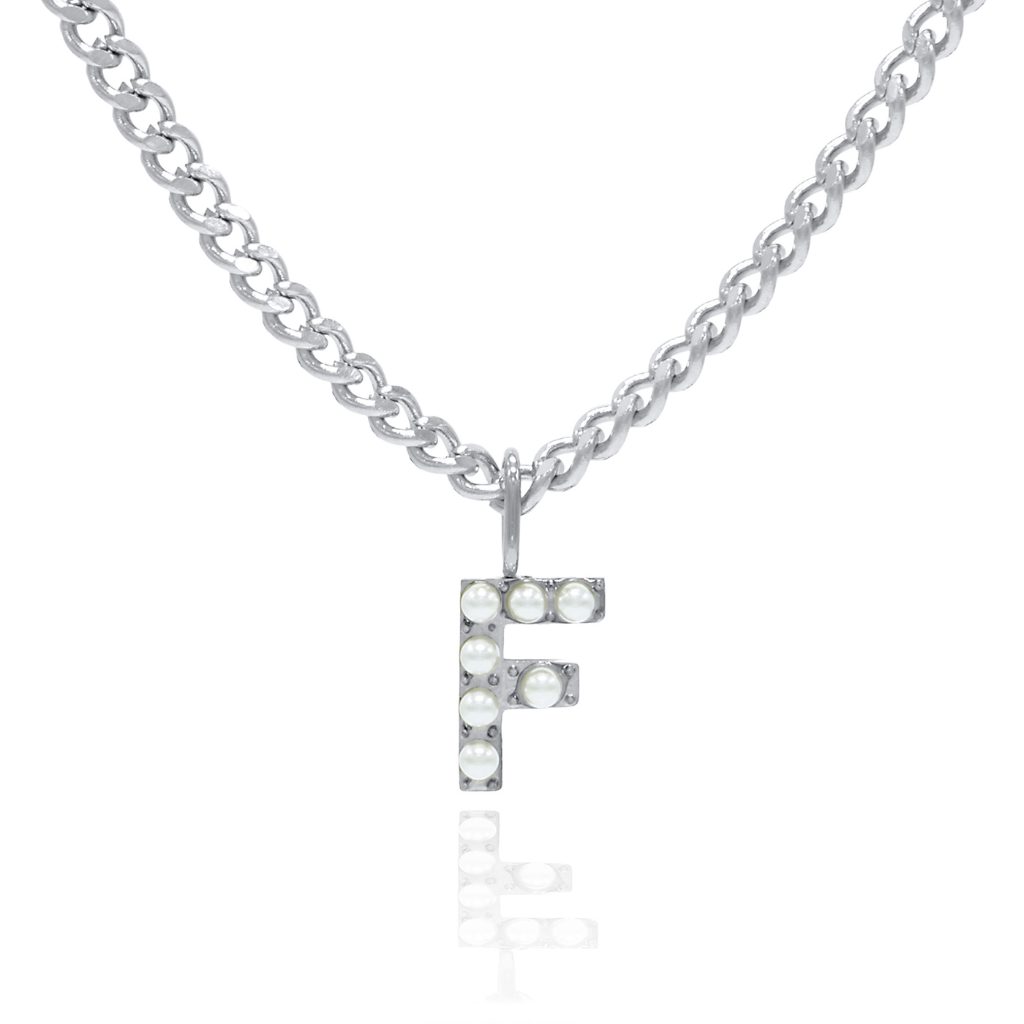 A silver-colored necklace with a pearl initial charm attached to a curb chain.